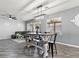Bright dining area with a wooden table, black chairs, and natural light at 1604 Patrick Thomas Ct, North Las Vegas, NV 89086