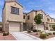 Beautiful townhome featuring desert landscaping, stone accents, and private gated entry, located in a desirable neighborhood at 1604 Patrick Thomas Ct, North Las Vegas, NV 89086