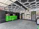 A custom garage with decorative ceiling lights, storage, and wall decor at 1604 Patrick Thomas Ct, North Las Vegas, NV 89086