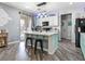 Stylish kitchen with a large center island, white cabinets, and modern appliances at 1604 Patrick Thomas Ct, North Las Vegas, NV 89086