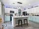 Bright kitchen showcasing a marble island, ample storage, and modern appliances at 1604 Patrick Thomas Ct, North Las Vegas, NV 89086