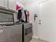 Laundry room with washer, dryer and upper cabinets at 1604 Patrick Thomas Ct, North Las Vegas, NV 89086