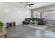 Cozy living room featuring a gray sectional sofa, area rug, and natural light at 1604 Patrick Thomas Ct, North Las Vegas, NV 89086