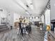 Spacious living area with an open floor plan that features a farmhouse-style dining table and cozy living space at 1604 Patrick Thomas Ct, North Las Vegas, NV 89086