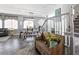 Cozy open-concept living area with hardwood floors and a staircase with decorative white banisters at 1604 Patrick Thomas Ct, North Las Vegas, NV 89086