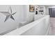 Bright loft space with gray carpet, white walls and a decorative star at 1604 Patrick Thomas Ct, North Las Vegas, NV 89086