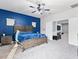 Comfortable main bedroom with a king bed, and access to an attached bonus room at 1604 Patrick Thomas Ct, North Las Vegas, NV 89086
