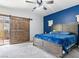 Stylish main bedroom featuring a sliding barn door, a king bed, and a large closet at 1604 Patrick Thomas Ct, North Las Vegas, NV 89086