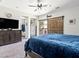 Spacious main bedroom with an adjacent bathroom, sliding barn door, and balcony access at 1604 Patrick Thomas Ct, North Las Vegas, NV 89086