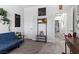 Versatile room with a blue futon, decorative wall hangings, and ample space for various activities at 1604 Patrick Thomas Ct, North Las Vegas, NV 89086