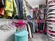 Well-organized walk-in closet showcasing ample storage with shelves and hanging space for clothes at 1604 Patrick Thomas Ct, North Las Vegas, NV 89086