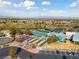 Sun City MacDonald Ranch aerial view featuring pool, golf course and tennis courts at 2029 Poppywood Ave, Henderson, NV 89012