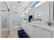 Modern bathroom boasts double sinks, marble countertops, and a glass enclosed shower at 2029 Poppywood Ave, Henderson, NV 89012