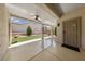 Enjoy the covered patio overlooking the backyard with synthetic grass at 2029 Poppywood Ave, Henderson, NV 89012
