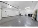 Spacious garage with epoxy floors, room for two cars, and extra storage space at 2029 Poppywood Ave, Henderson, NV 89012