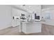 Modern kitchen featuring an eat-in island, pendant lighting, and stainless steel appliances at 2029 Poppywood Ave, Henderson, NV 89012