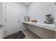 Mud room with counter top, marble backsplash, and a door that leads outside at 2029 Poppywood Ave, Henderson, NV 89012