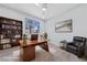 Cozy home office with built-in shelving and lots of natural light at 2029 Poppywood Ave, Henderson, NV 89012