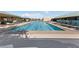Relaxing lap swimming pool surrounded by lounge chairs for residents' enjoyment at 2029 Poppywood Ave, Henderson, NV 89012