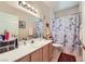 Well-lit bathroom features clean lines and a practical layout with vanity and shower at 2050 W Warm Springs Rd # 3211, Henderson, NV 89014