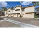 Attractive townhomes boast desert landscaping, charming exteriors, and private garages for easy living at 2050 W Warm Springs Rd # 3211, Henderson, NV 89014