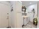 Functional laundry room includes washer, dryer, and extra storage for convenience at 2050 W Warm Springs Rd # 3211, Henderson, NV 89014