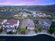 An aerial view of a home with a red tile roof and landscaped yard in a planned community at 2116 Canvas Edge Dr, Henderson, NV 89044