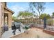 Spacious backyard featuring a stainless steel BBQ, and comfortable lounge chairs at 2116 Canvas Edge Dr, Henderson, NV 89044