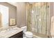 Contemporary bathroom featuring a glass shower, granite countertops, and stylish fixtures at 2116 Canvas Edge Dr, Henderson, NV 89044