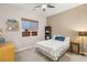 Inviting bedroom with ample sunlight, bookshelf, and comfortable decor at 2116 Canvas Edge Dr, Henderson, NV 89044