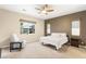 Bright bedroom featuring a cozy chair and a large window providing natural light at 2116 Canvas Edge Dr, Henderson, NV 89044