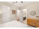 Cozy bedroom with connecting bathroom, closet, and light wood dresser at 2116 Canvas Edge Dr, Henderson, NV 89044
