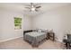 Comfortable bedroom with a ceiling fan and window views for a relaxed atmosphere at 2116 Canvas Edge Dr, Henderson, NV 89044
