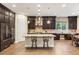 Modern kitchen with an island, stainless steel appliances, and dark wood cabinetry at 2116 Canvas Edge Dr, Henderson, NV 89044