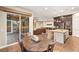 Open concept home with hardwood floors showcasing living, kitchen and dining area at 2116 Canvas Edge Dr, Henderson, NV 89044