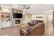 Spacious living room with a fireplace, built-ins, wood floors, and comfortable seating at 2116 Canvas Edge Dr, Henderson, NV 89044