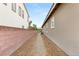 Side yard features low-maintenance gravel and brick privacy wall at 2116 Canvas Edge Dr, Henderson, NV 89044