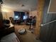Bedroom featuring neutral carpet, computer and gaming equipment at 225 Greenbriar Townhouse Way, Las Vegas, NV 89121
