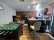 Kitchen area featuring a game table and stainless steel appliances at 225 Greenbriar Townhouse Way, Las Vegas, NV 89121