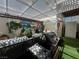 Outdoor patio area featuring a covered pergola, grill, and artificial turf at 225 Greenbriar Townhouse Way, Las Vegas, NV 89121