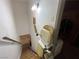 Stairway with stair lift, wood handrail, and a light fixture at 225 Greenbriar Townhouse Way, Las Vegas, NV 89121