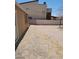 Expansive backyard featuring ample space and a neighboring building at 2417 St George St, North Las Vegas, NV 89030