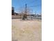 Open backyard area with a tree and views of the street at 2417 St George St, North Las Vegas, NV 89030