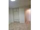 Bedroom with carpet, built-in cabinets and a doorway at 2417 St George St, North Las Vegas, NV 89030