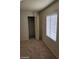 Bedroom with carpet and a window covered with white blinds at 2417 St George St, North Las Vegas, NV 89030
