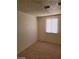 Bedroom with carpet and a window covered with white blinds at 2417 St George St, North Las Vegas, NV 89030