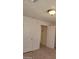 Bedroom with carpet, ceiling light, and two doorways at 2417 St George St, North Las Vegas, NV 89030