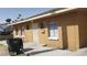 Single-story building shows simple structure, functional windows, and a security door at 2417 St George St, North Las Vegas, NV 89030