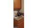 Close up of functional kitchen cabinets and countertops with assorted kitchen appliances and utensils at 2417 St George St, North Las Vegas, NV 89030
