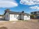 An exterior back view of the home featuring a fenced yard and partial view of the roof at 26 E Atlantic Ave, Henderson, NV 89015